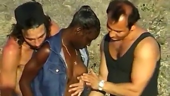 African Woman Enjoys A Threesome With Two White Men By The Seaside